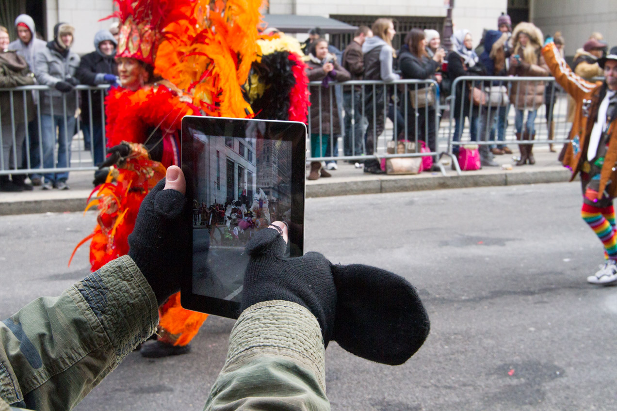 Reveler taking a photo with their ipad